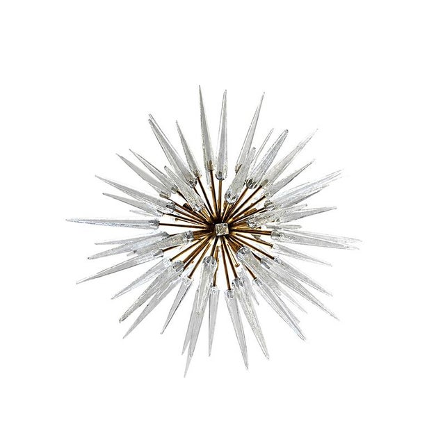 Modern Sputnik lamp. A brass rod with a hemispherical upper end supports a sphere to which numerous symmetrically arranged...