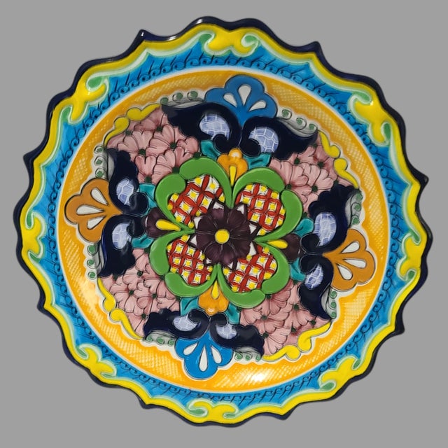 Add a touch of Mexican culture to your home with this beautiful hand-painted art wall hanging plate from Talavera. The...