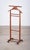 Elegant 1960s valet stand crafted in stained beech wood. Designed with a shaped hanger for jackets and a convenient pull-...