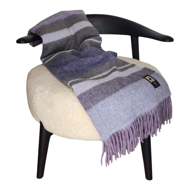 This throw blanket crafted in Peru from 100% premium alpaca fiber is renowned for its silky feel, natural warmth, and...