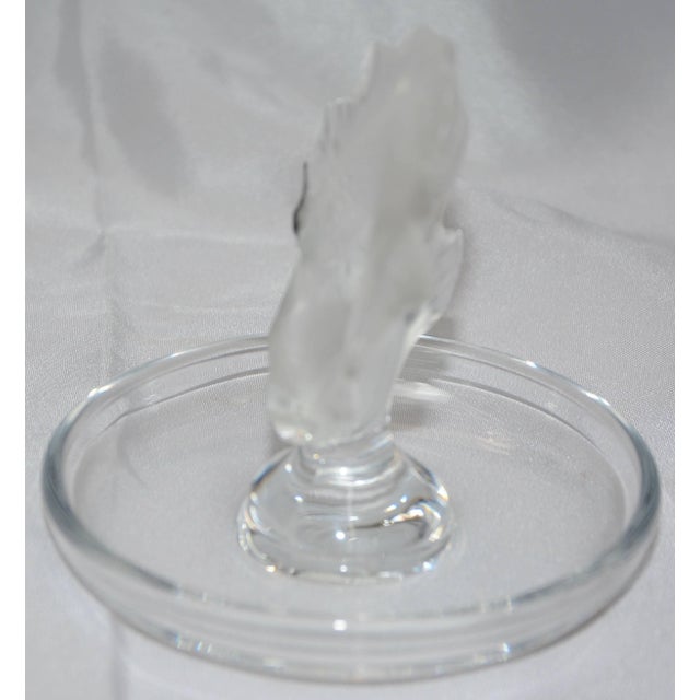 We are offering a Lalique of France Koi fish finished in their well-known satin glass. He is jumping from a clear crystal...