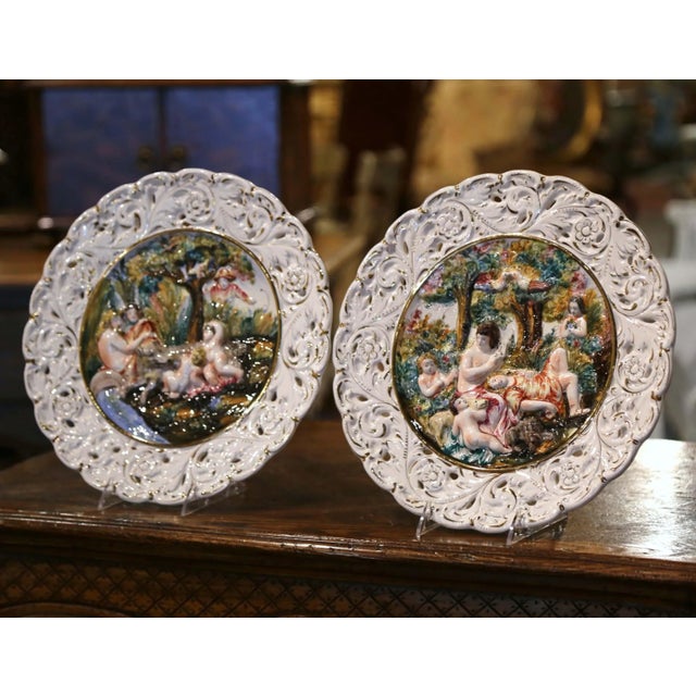 This beautiful pair of majolica wall plates would elevate any living room, kitchen, or dining room wall. Created in Italy...