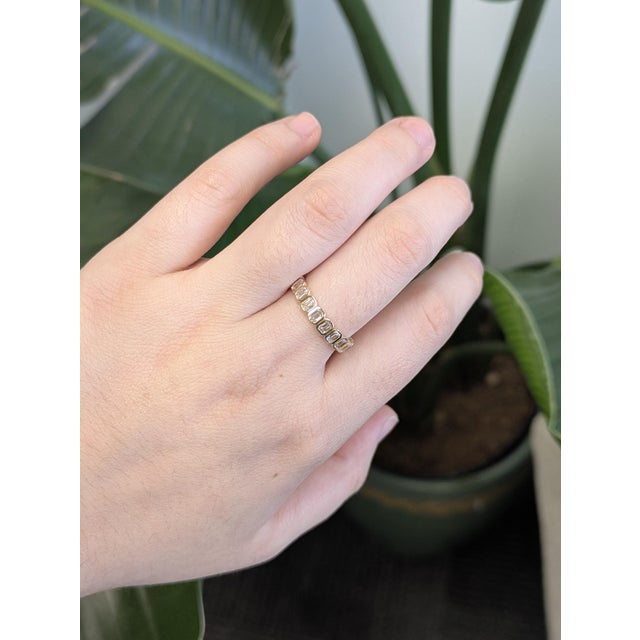 Shine with sophistication in this 1.6ct Golden Glow lab-created diamond band. Set in solid 14K yellow gold, the emerald-...