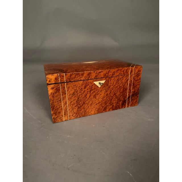 Elegant 19th-century French ladies’ jewelry box dating to circa 1890, crafted in richly figured burl elm with decorative...