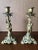 Pair of metal Candlesticks. Male and female figures. These figures represent the two seasons of Summer and Winter. The...