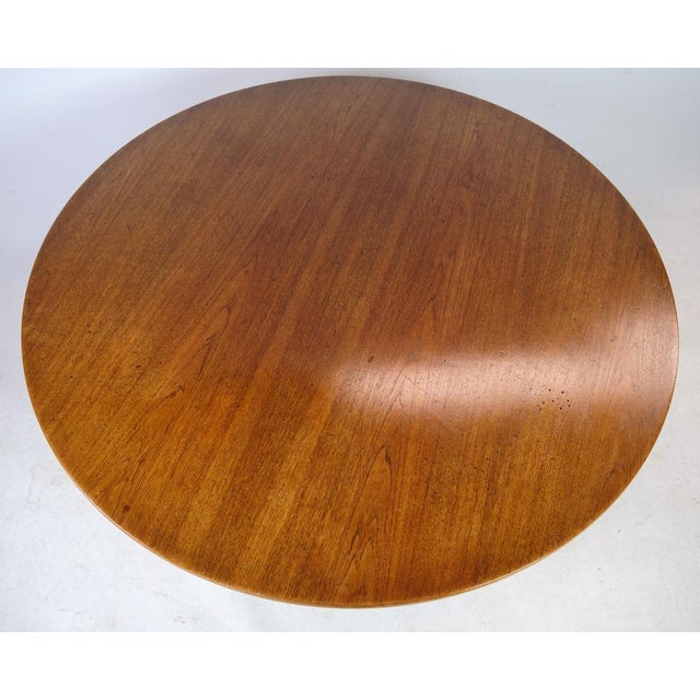 The coffee table in teak and solid oak frame was designed by Hans J. Wegner for Andreas Tuck in the 1950s. This is an...
