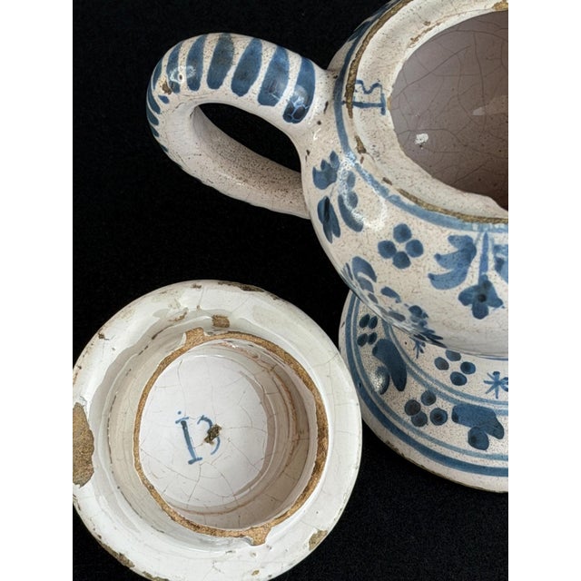 Exceptional late-18th-century french faience posset pot (pot à crème), decorated in blue on a tin-glazed white ground....