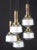 Modern wood and brass cascade chandelier with five glass cup. Five E 14 light bulbs. Up to 250V (Europe/UK Standard).The...