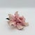 A beautifully rendered porcelain lily sculpture capturing the soft movement and natural drama of a fully opened bloom. Six...