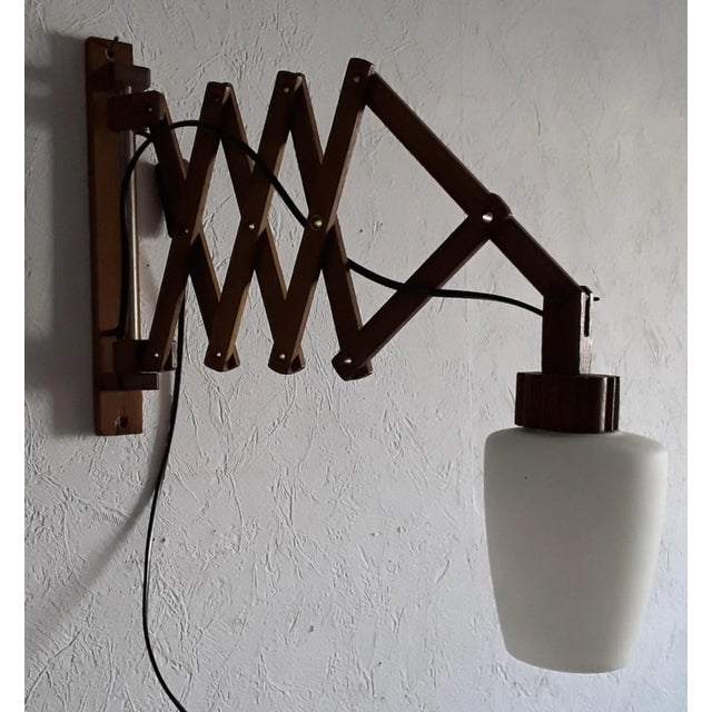 Vintage Pull-Out Field Frame in Teak with White Opaque Glass Umbrella Wall Lamp, 1960s, in Good conditions. Designed 1960...