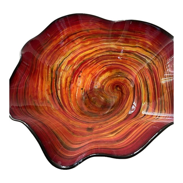 Stunning hand-blown Murano glass bowl in bright colors of reds, orange and slight yellows. Artist signed. The original...