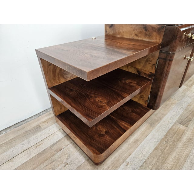 A refined Italian Art Deco dressing table crafted from walnut and blond walnut, featuring an elegant, geometric design...