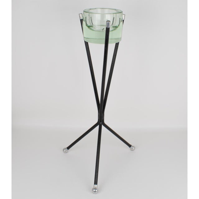 This superb side table with a glass vide poche was crafted in France circa 1950. The rare geometric three-foot stand...