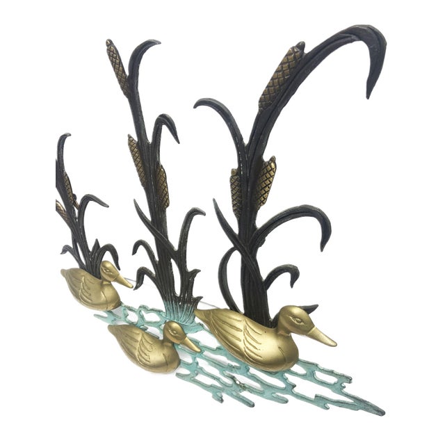 The Vintage 80s Brass and Iron Wall Hanging Ducks on Pond is a stunning decorative piece that captures the charm of nature...
