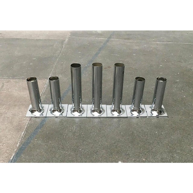 Simple ceiling or wall lights from Staff according to a design by Rolf Krüger. A simple cylinder shape that merges into a...