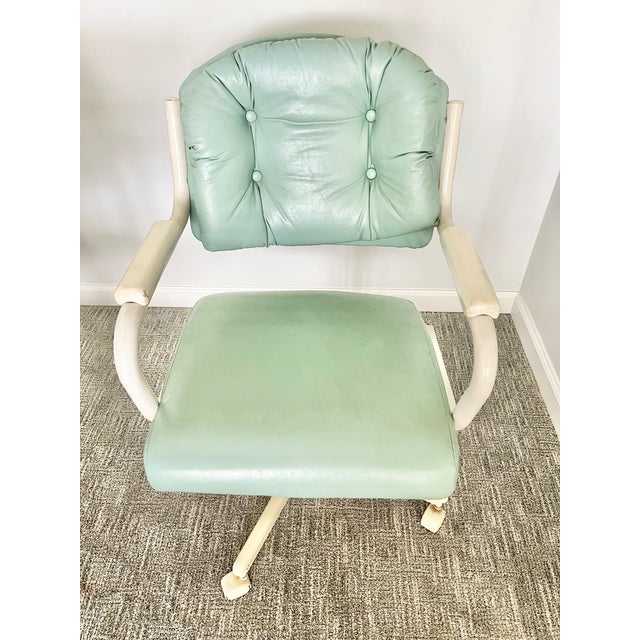 Retro vintage Chromcraft seafoam green rolling dinette chairs featuring a distinctive mid-century modern design....