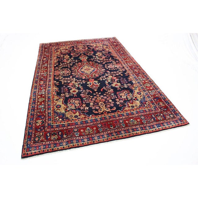 Hand-knotted Middle Eastern rug | Size: 330×210 cm | Knot density: deep pile | Material: 100% wool | Pattern: medallion |...