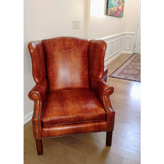 Elevate your space with this stunning Vintage Dutch Cognac Colored Wingback Leather Club Chair. Handmade in Holland by...