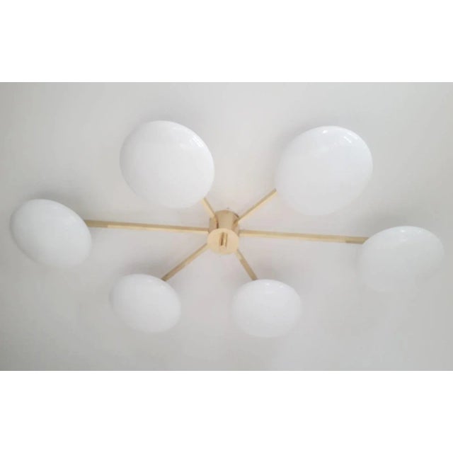 Italian asymmetrical flush mount with six glossy white Murano glass shades mounted on solid brass frame in unlacquered...