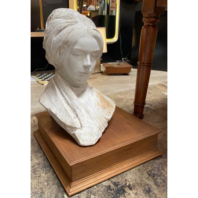 Beautiful Italian plaster sculpture representative half woman , the sculpture comes with a wood base.