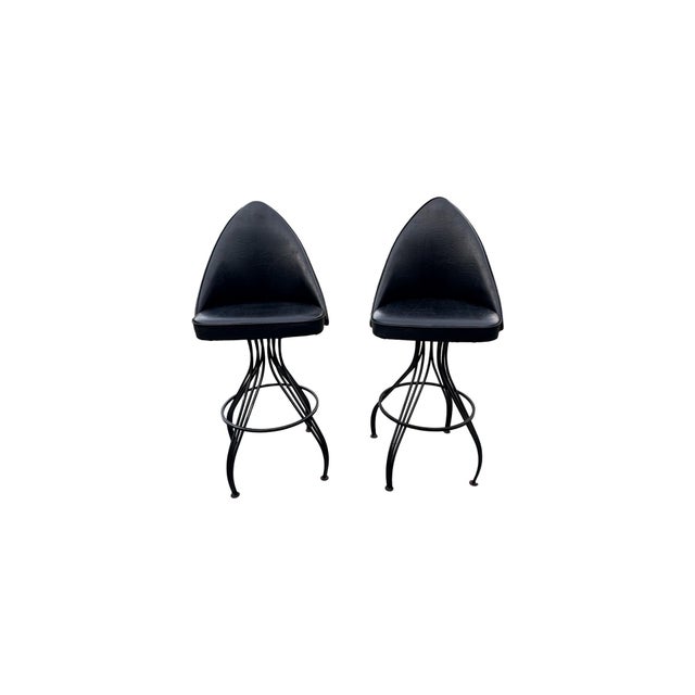 Striking pair of vintage Daystrom Furniture, Inc. swivel bar stools, circa late 1960s–early 1970s. These sculptural stools...