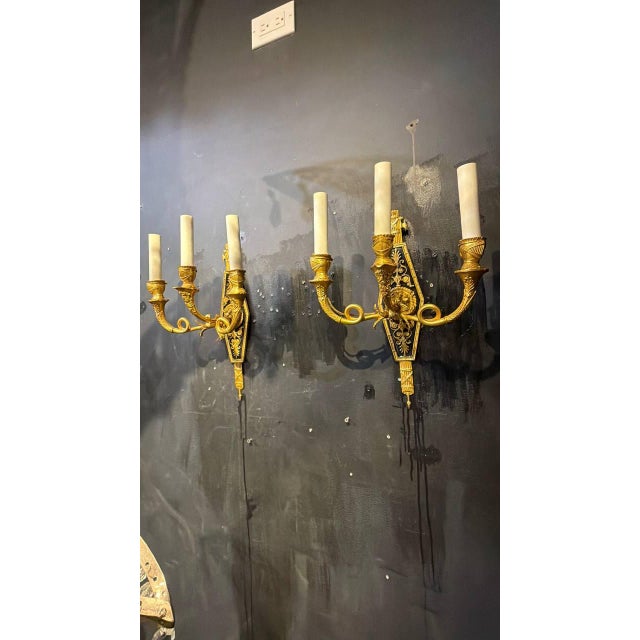 Circa 1920 French Empire style 3 lights sconces, with Lions heads and warriors helmets as cups