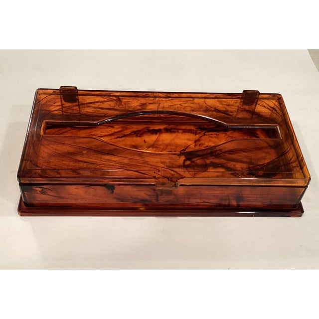 This fabulous 1970s Lucite Oblong Tortoise Shell Tissue Box Cover will be an eye-catching accessory in your home. This...
