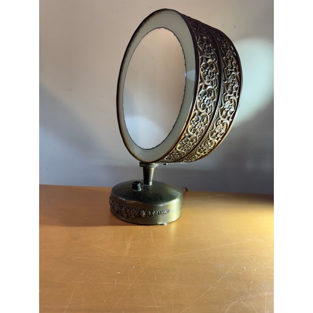 Step back into the golden age of Hollywood glamour with this exquisite mid-century modern lighted makeup mirror by Casco,...