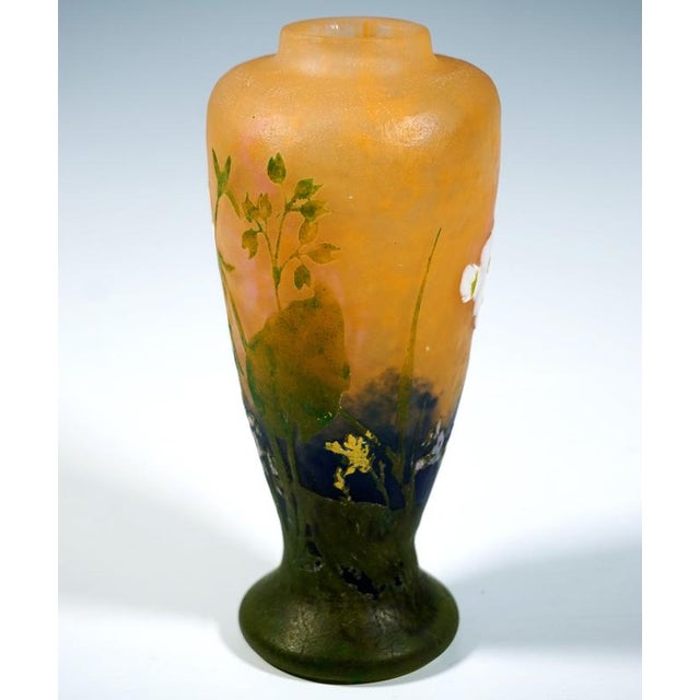 Primevères' Vase with a body that bulges out towards the shoulder on a raised foot, with flattened display sides;...