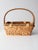 This vintage wicker basket has a distinctive style, blending natural materials with a functional form. The rectangular...