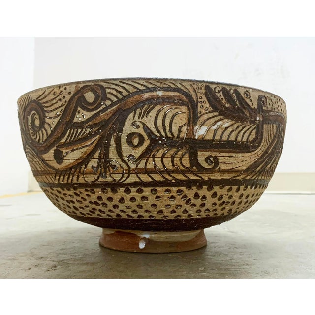 A sgrafitto carved and slip decorated centerpiece bowl by the Bauhaus trained potter Frans Wildenhain. It displays various...