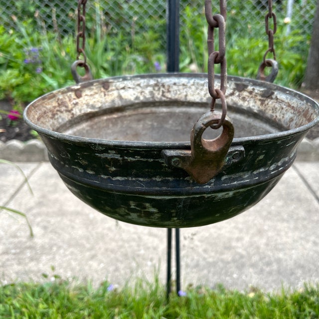 This Antique Handmade Silver on Copper Handing Cauldron/Pot is a unique and charming piece of collectible metalware....