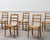 Set of 6 neo-retro style chairs, made of solid beech. Their simple lines, with spindle backs and turned legs, are...