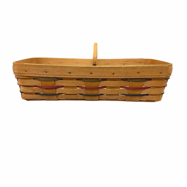 Offering this vintage 1990s Longaberger divided bread or cracker basket, handwoven with colorful red, green, and blue...
