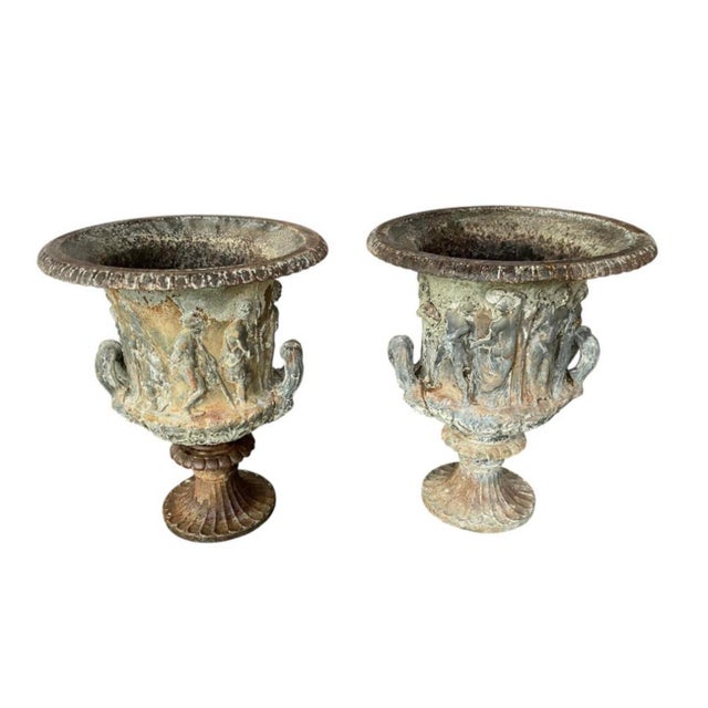 Rare Pair of Monumental French Cast Iron Medici/Borghese Garden Urns. Urns are adorned with sculptural classical reliefs...