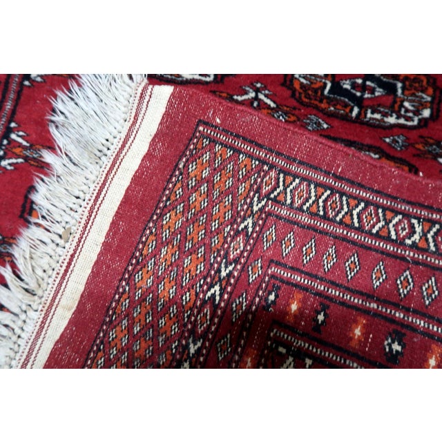 Authentic Vintage Uzbek Bukhara Rug Introduce the rich, storied tradition of Central Asian weaving into your space with...
