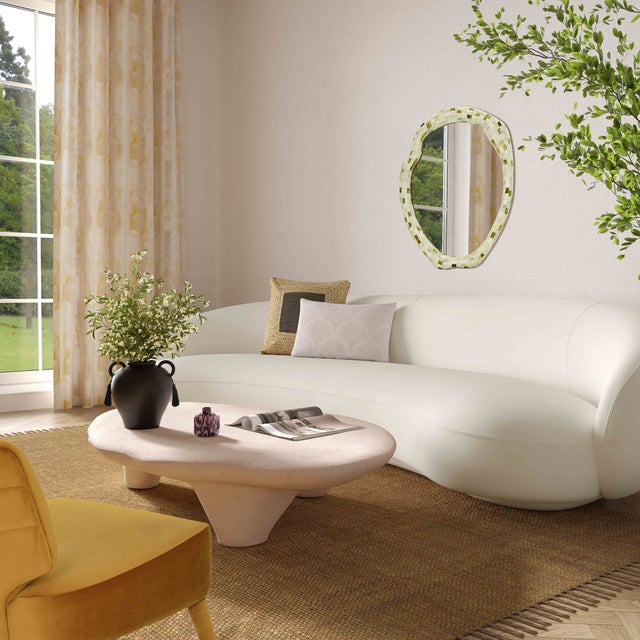 Elevate your living space with this captivating Athen Faux Stone Coffee Table! The nude-colored faux stone is a statement...