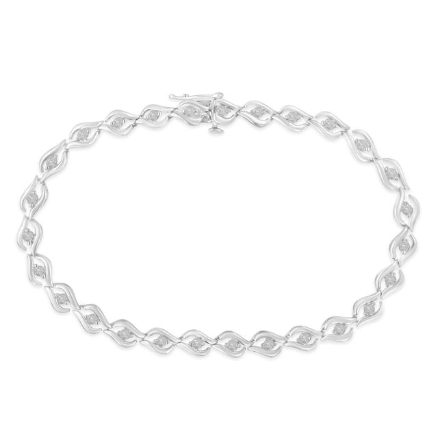 Elegant and timeless, this gorgeous sterling silver tennis bracelet features 0.5 carat total weight of round, rose cut...