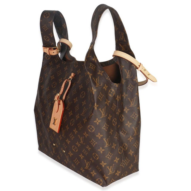 Item #: 150587 Exterior Material: Canvas Size: MM Interior Material: Fabric Dimensions: 13.25 x 12.5 x 5.25 in Handbag...