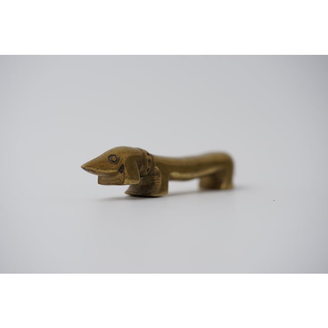 Object: Bottle opener in the shape of a dachshund Designer: Walter Bosse (1904–1979) Age: 1950s/1960s Material: Brass...