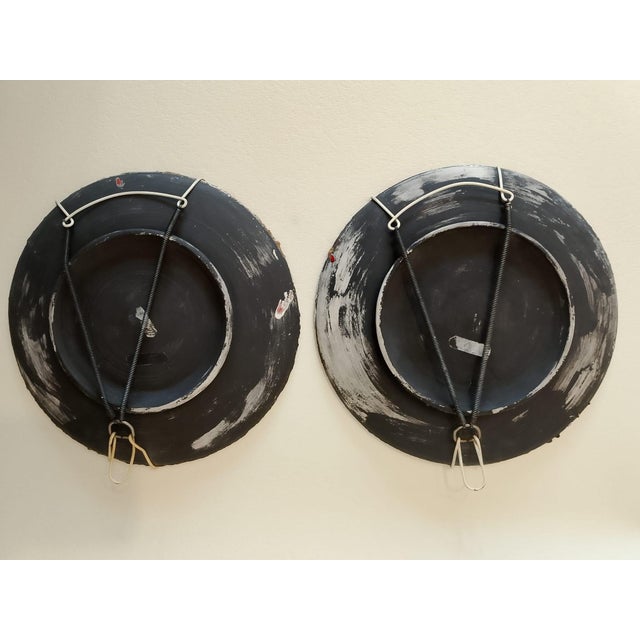 Excellent condition with original metal hanging device and partial manufacturer labels