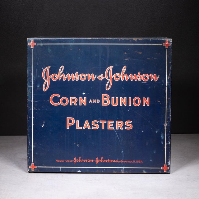 ABOUT Antique Johnson & Johnson drug store counter display cabinet with six drawers. Vivid graphics on five sides....