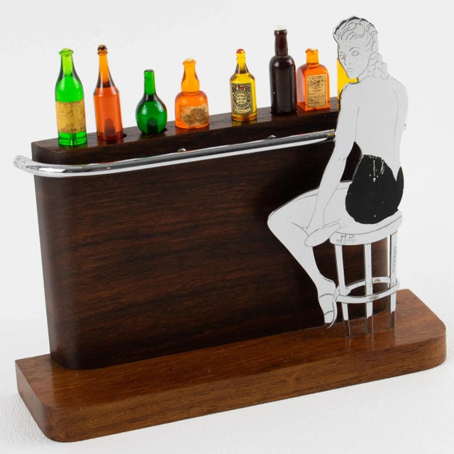 Stunning Art Deco Cocktail Picks Ensemble with Macassar Wood Bar and Lady Figurine – France, circa 1930. Improve your...