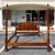 This Baker Furniture king size poster bed frame showcases beautifully figured flamed mahogany, with a graceful arched...