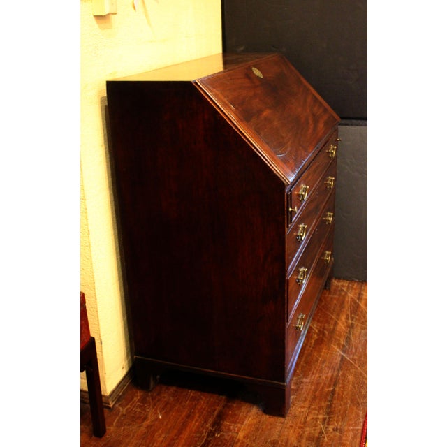 Circa 1780-1800 George III slant front bureau or desk, English. Mahogany. A handsome example - the interior with obelisk...