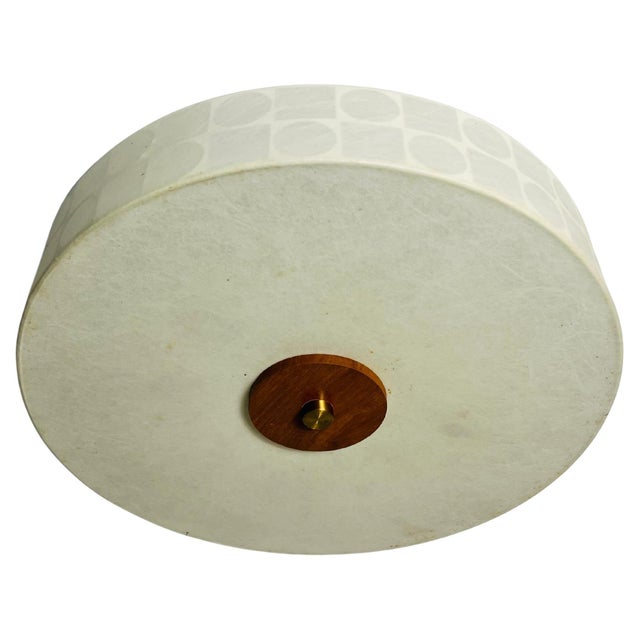 This elegant Cocoon ceiling lamp, crafted in Italy during the 1960s, embodies the sleek and timeless style reminiscent of...