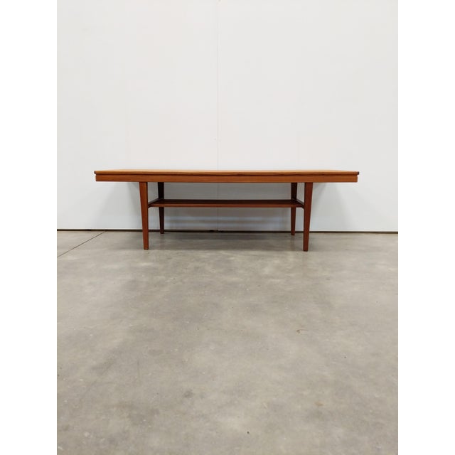 Authentic vintage mid century modern teak coffee table. This piece is in excellent condition with very few signs of age-...