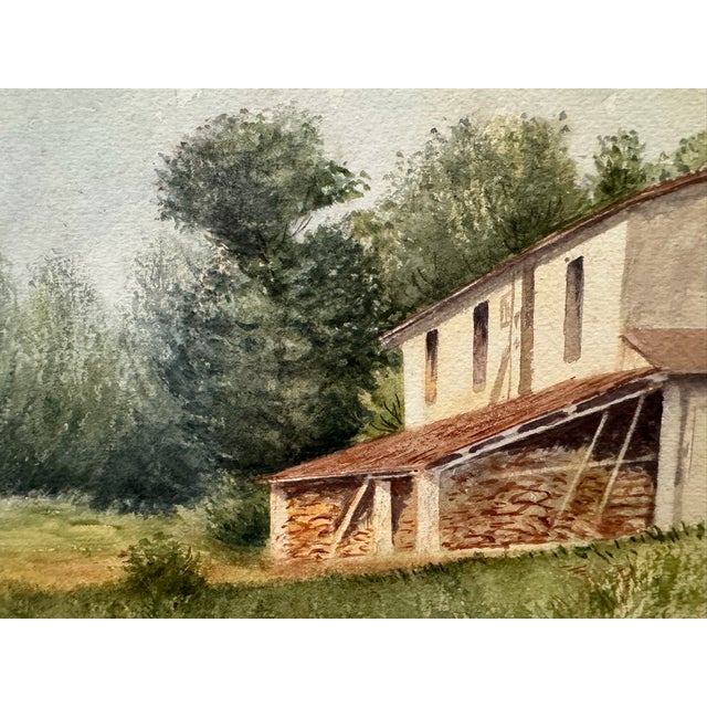 Original watercolor on paper depicting a rural country house or farm building with a red tile roof, stone lower structure,...