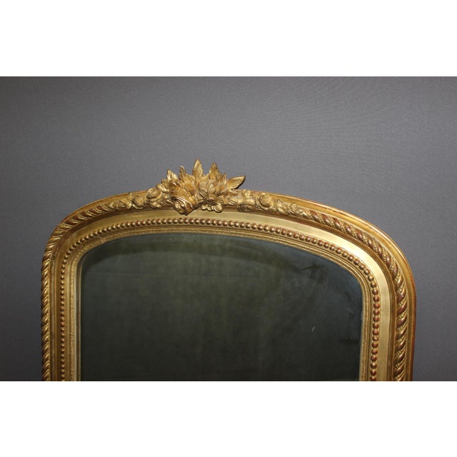 Louis XVI style mirror from the Napoleon III period in gilt stucco, original gilding, mercury mirror, circa 1880, in very...