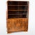 Elegant Art Deco bookcase from the 1930s. The structure is veneered in burr walnut with a striking grain, most prominent...
